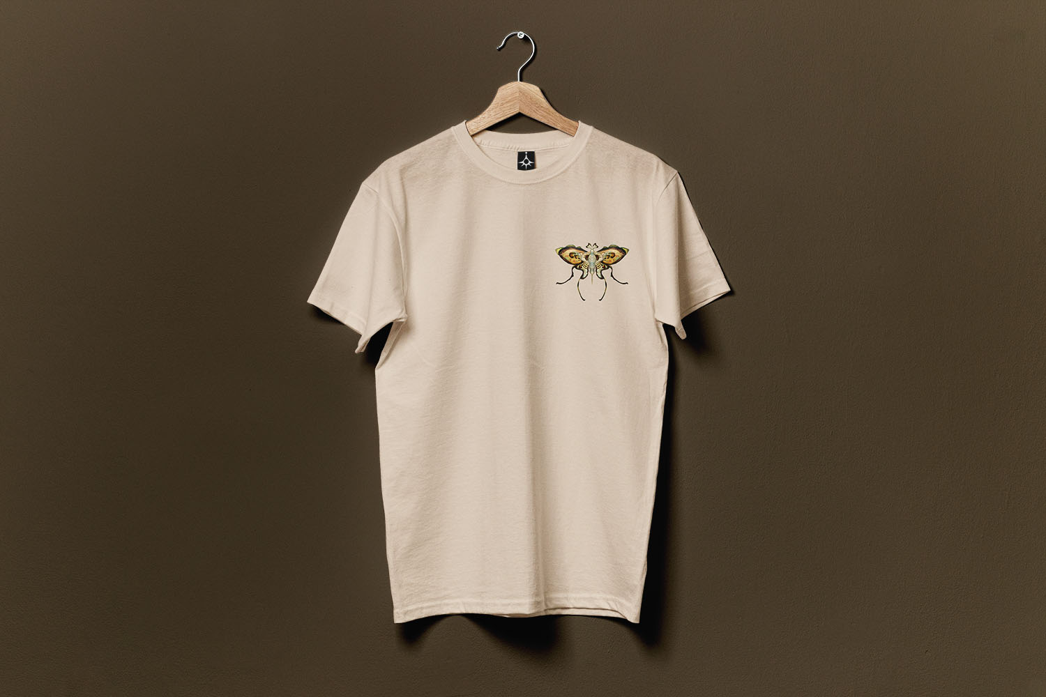 T-shirt design featuring surreal botanical butterfly illustration by Jon Jacobsen.