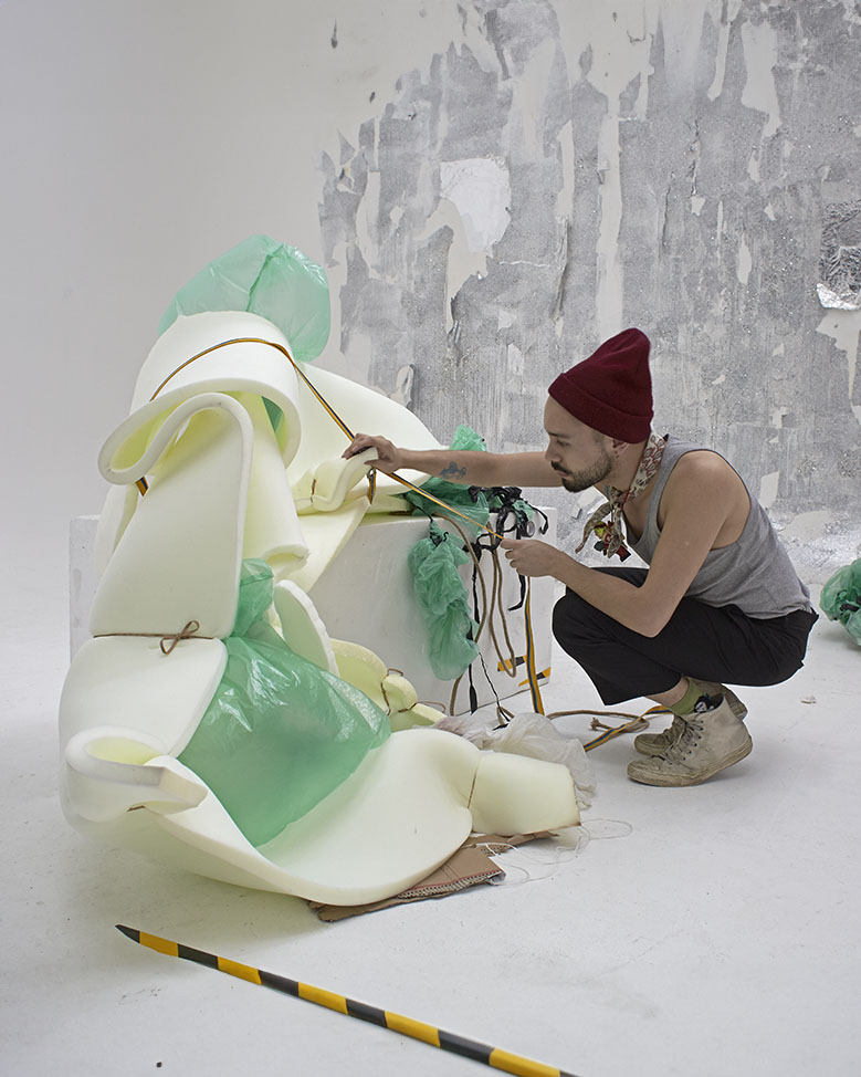 Jon Jacobsen working on an abstract sculptural shape for a photoshoot, showcasing his creative process.